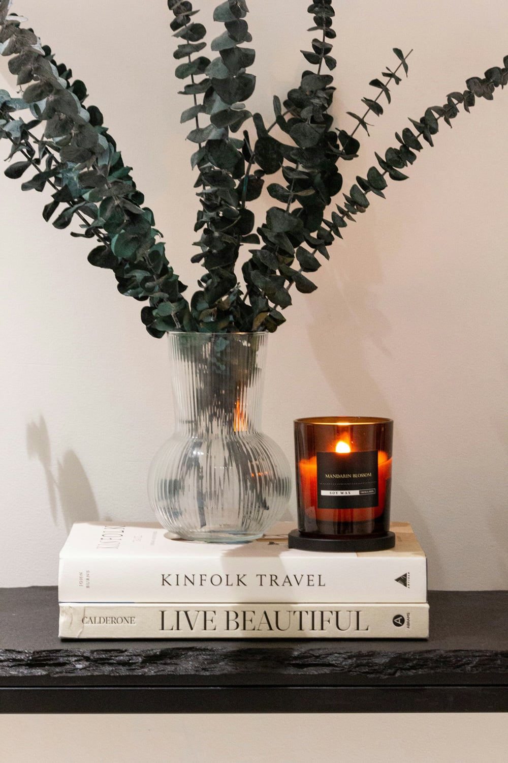 scented candle on books