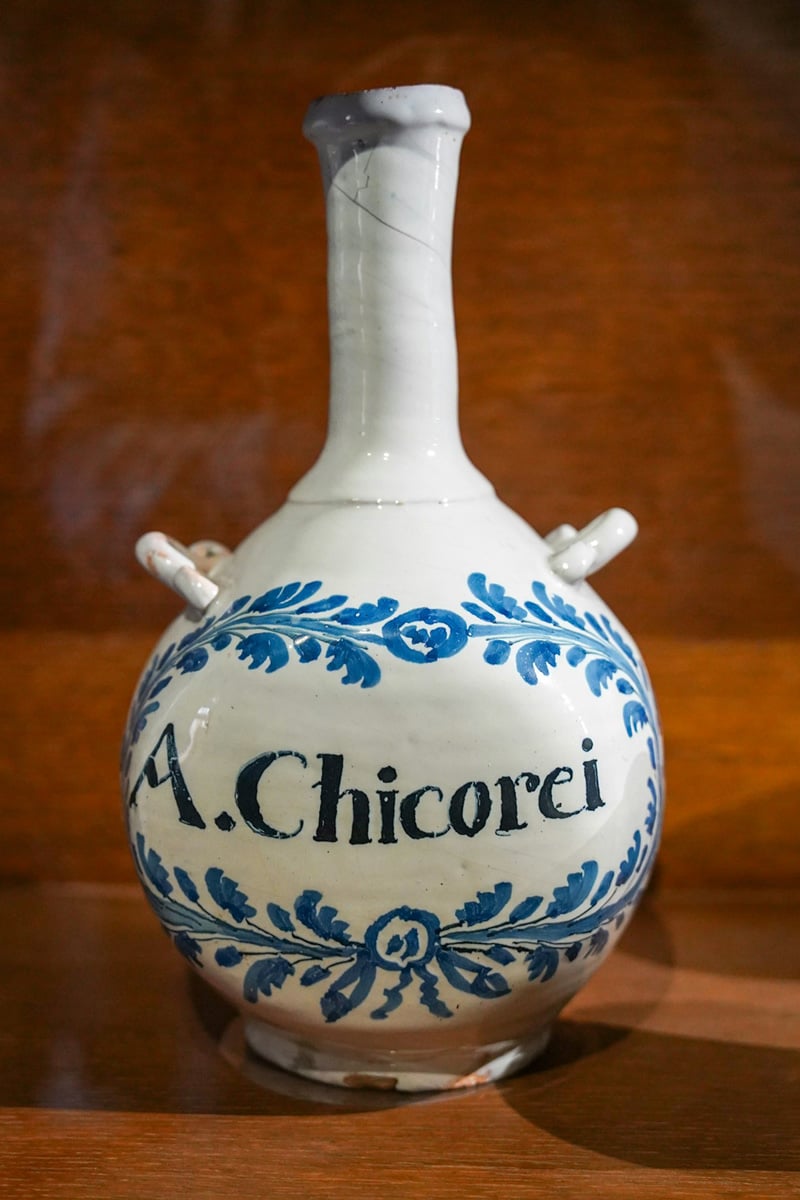 antique ceramic bottle with blue floral design