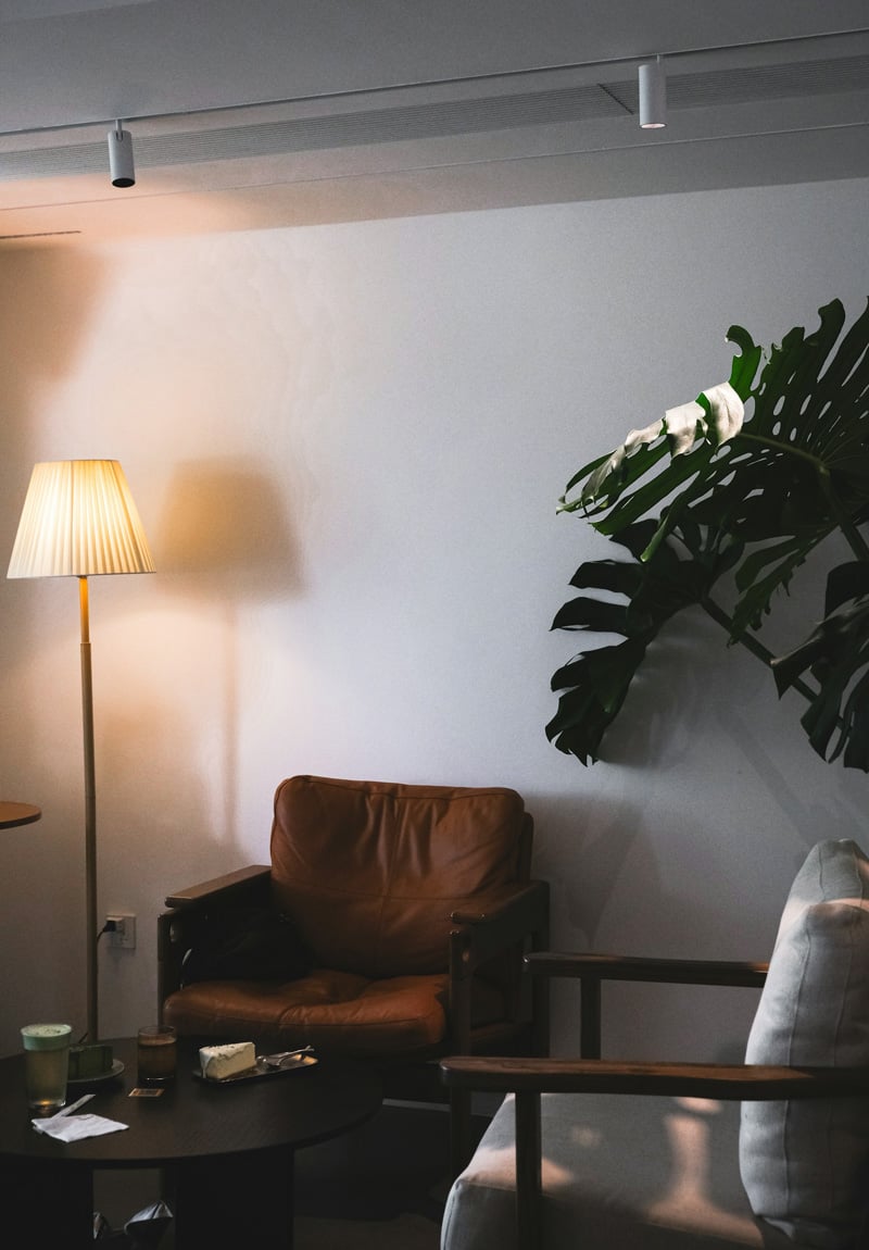 living room with warm floor lamp