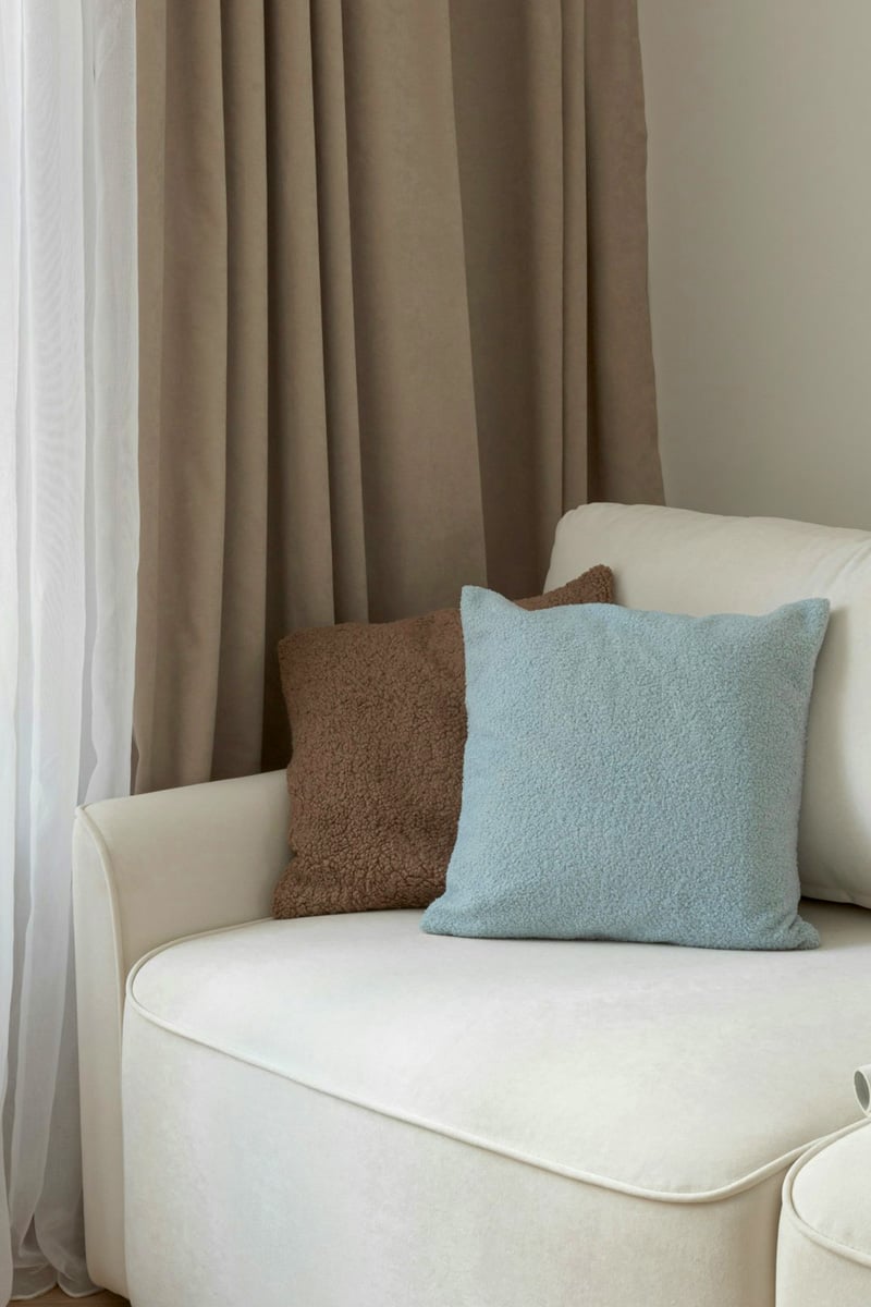 Soft blue and brown pillows living room