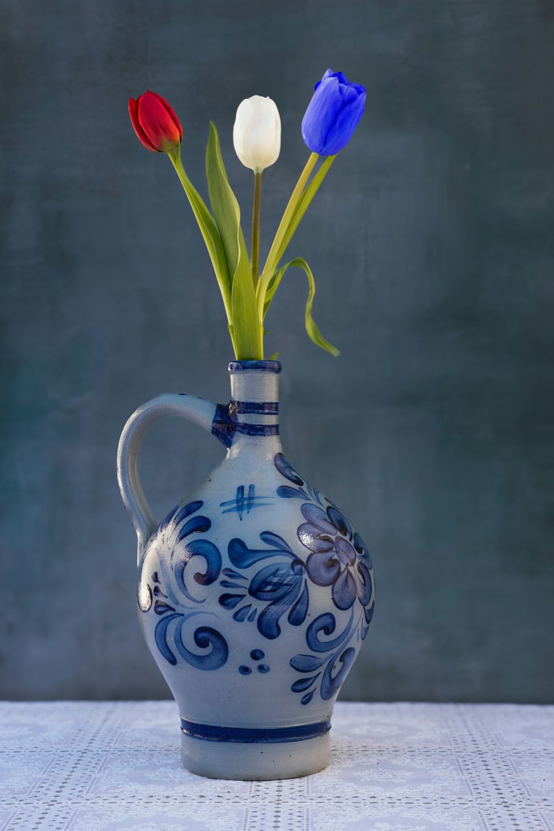 blue ceramic vase with tulips