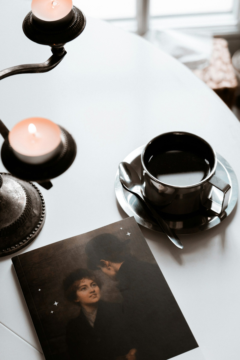 candles cup of coffee book