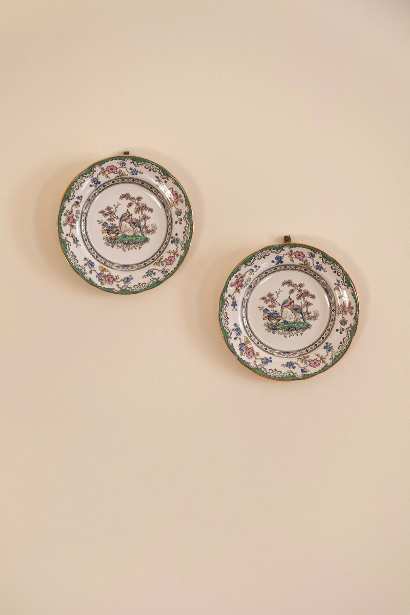 ceramic plates on cream wall