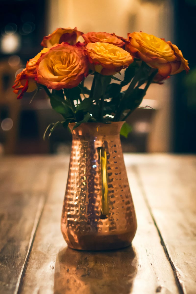 roses in a copper vase